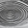 A monochromatic image of a single droplet of water creating ripples in a still pool, capturing a moment of tranquility4, Generat