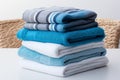 Monochromatic luxury Stacked blue, white, and gray towels exude sophistication