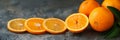 A monochromatic orange palette, Oranges with leaves on a grey concrete background
