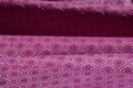 Rippled purple patterned ethnic fabric background