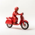 Monochromatic Toy Sculpture Of A Person Riding A Scooter