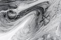 Monochrome abstract background formed by mixing white and black paints Royalty Free Stock Photo