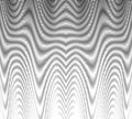 Monochrome abstract texture with wavy linear graphic and moire effect.