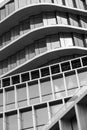 Monochrome architecture, curved lines of a modern building facade, pattern of windows and balconies, Royalty Free Stock Photo