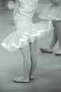 Monochrome - baby ballet students in little pink tutu with pink satin ribbon, leotard and ballet wrap