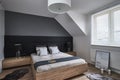 Monochrome bedroom with gray walls and lamps