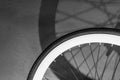 Monochrome of bicycle wheel with light and shadow, bicycle part, close up details,