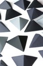 Monochrome black and gray tetrahedrons background. Royalty Free Stock Photo