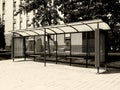 Monochrome bus shelter with blank poster and billboard advert with light box Royalty Free Stock Photo