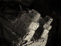 Monochrome close up of rusted threaded nuts and bolts on old corroded industrial machinery