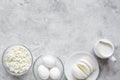 Monochrome concept with dairy products on stone table top view mock up