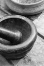 Monochrome design cooking gray stone mortar close-up, cook tools background Royalty Free Stock Photo