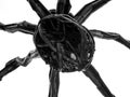 Monochrome detail of spider sculpture from beneath