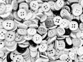 Monochrome disorderly small sewing buttons background