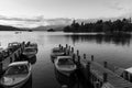 Monochrome Dusk scene of Boats moored in piers in Cumbria Royalty Free Stock Photo