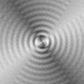 Monochrome Expanding Waves Intersect in the Center. Optical Effect of Volume and Movement