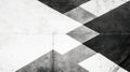 Monochrome geometric shadow pattern on pavement offering an abstract copy space image