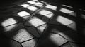 Monochrome geometric shadow pattern on pavement offering an abstract copy space image