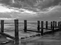 Monochrome image of a breakwater in the Baltic Sea near to Zingst, Mecklenburg-Western Pomerania, at twilight Royalty Free Stock Photo