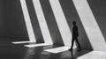 A monochrome image capturing the silhouette of a man walking through a hallway with striking light, AI Generated Royalty Free Stock Photo
