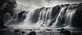 Monochrome image of a majestic waterfall in a natural landscape Royalty Free Stock Photo