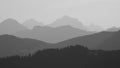 Monochrome image of mountain ranges in the morning light