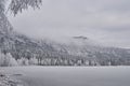 Monochrome image with mountain top popping up from the fog. Royalty Free Stock Photo