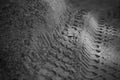 Monochrome industrial sand with tire marks Royalty Free Stock Photo