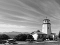 Monochrome of a light house in Homer, Alaska with trees and benches around Royalty Free Stock Photo