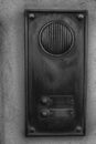 Monochrome Old intercom on home exterior. Royalty Free Stock Photo