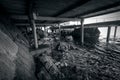 Monochrome photo of beach under the old wooden pier Royalty Free Stock Photo