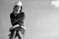 Monochrome photo of a business woman sitting on chair associated