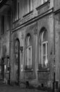 Monochrome photo of the exterior of an old prayer house in Kazimierz, the historic Jewish quarter of Krakow, Poland.