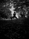 Monochrome photo of a man practicing karate in the morning Royalty Free Stock Photo