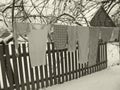 Monochrome photo of rural laundry in old village of Belarus, traditional female housework