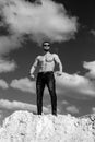 Monochrome photo of sportive bodybuider posing