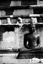 Monochrome photo of a statue of a lord buddha.