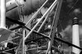 Monochrome photography of the temple`s pipes and scaffolding.