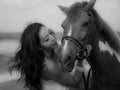 Monochrome. Portrait of Asian woman and horse. Woman hugging horse. Romantic concept. Human and animals relationship. Black-white Royalty Free Stock Photo