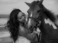 Monochrome. Portrait of Asian woman and horse. Woman hugging horse. Romantic concept. Human and animals relationship. Black-white Royalty Free Stock Photo