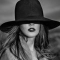 Monochrome portrait of elegant beautiful woman wearing a hat Royalty Free Stock Photo