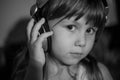 Monochrome portrait of girl in headphones. Girl listening music Royalty Free Stock Photo