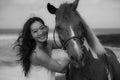 Monochrome. Portrait of happy woman and horse. Woman hugging horse. Romantic concept. Human and animals relationship. Black-white Royalty Free Stock Photo