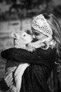 Monochrome portrait of woman cuddling little lamb Royalty Free Stock Photo