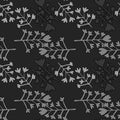 Monochrome seamless pattern with branches silhouettes. Simple backdrop with random grey botanic elements on black background