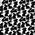 Monochrome seamless pattern with rabbits in various poses. Vector texture with tight black hares on white background