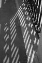 Monochrome shadow of a fence, Moscow river embankment on a sunny summer day, Moscow, Russia