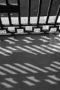 Monochrome shadow of a fence, Moscow river embankment on a sunny summer day, Moscow, Russia