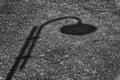 Monochrome Shadow of street lamp in sunny day, road lantern in park