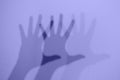 Monochrome shadows of a hand dancing to the music. Interactive exposition in science museum. Banner in trendy 2022 color